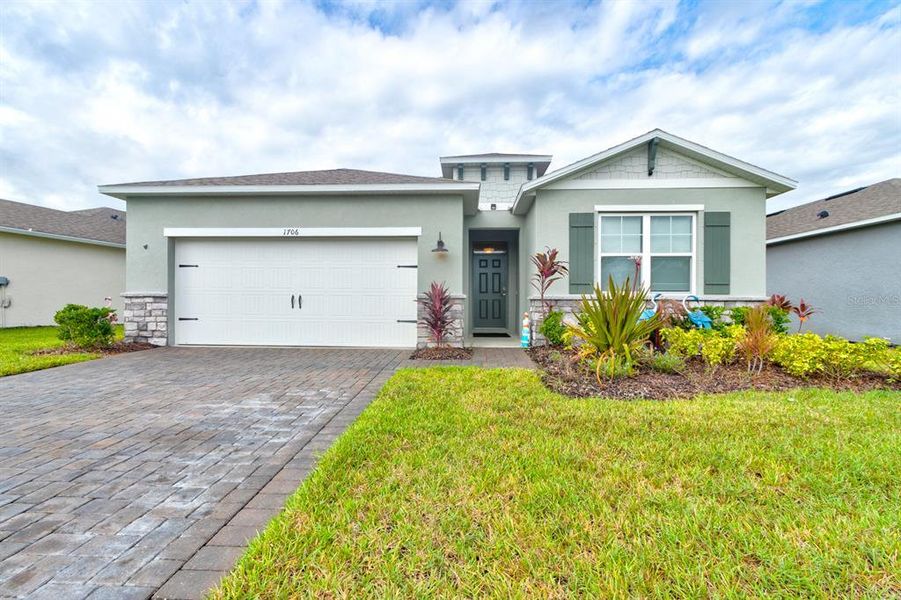 Front exterior of a new home in , New Smyrna Beach, FL, highlighting curb appeal (Image 1).