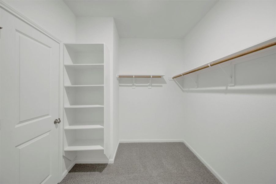 Primary walk-in closet Primary walk-in closet