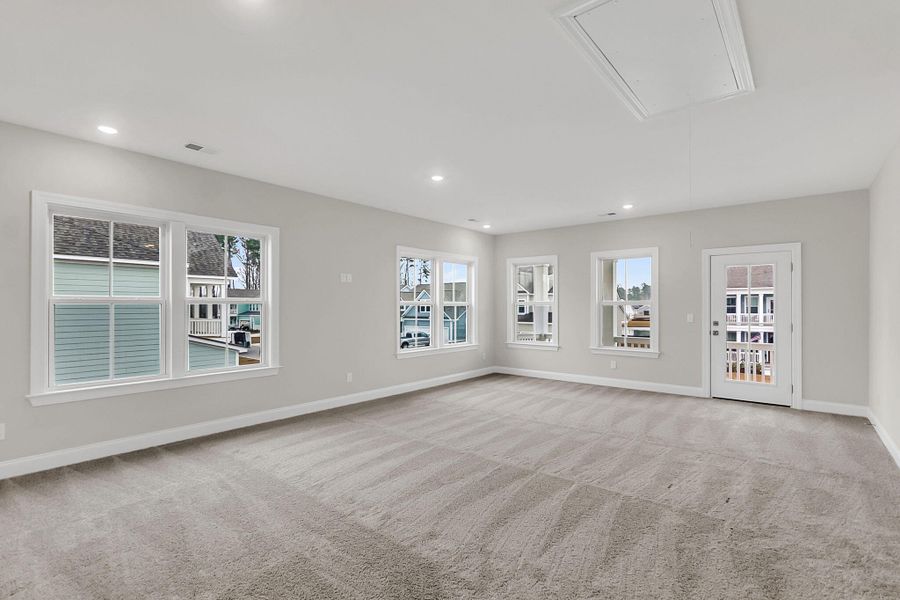 Spacious, unfurnished interior of a new home in Tidewater at Lakes of Cane Bay, Summerville (Image 31).