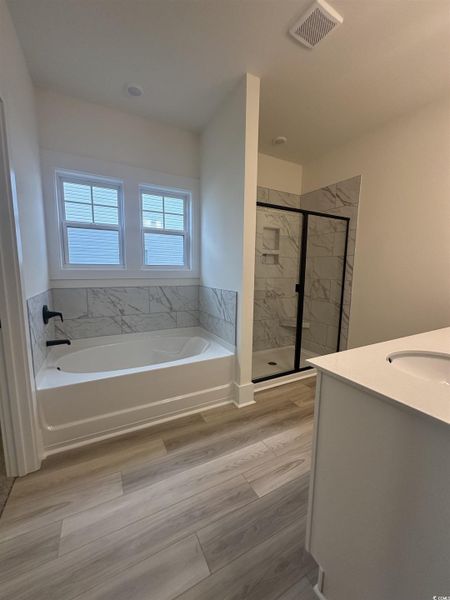 Unfurnished room featuring light carpet and a ceiling fan Unfurnished room featuring light carpet and a ceiling fan