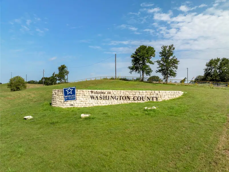 Front exterior of a new home in , Washington, TX, highlighting curb appeal (Image 2).