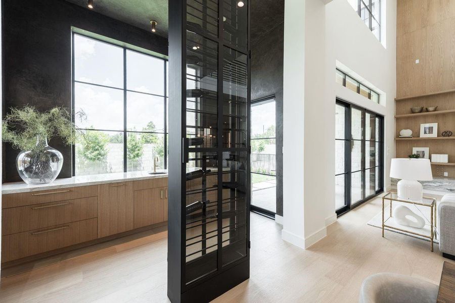 More than storage, this vertical wine gallery is a statement in refined living. Positioned between the dining room and wet bar, it anchors the space with modern sophistication—turning every bottle into part of the home’s design narrative.