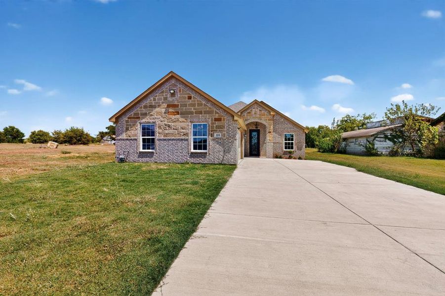 Front exterior of a new home in , Ferris, TX, highlighting curb appeal (Image 22).