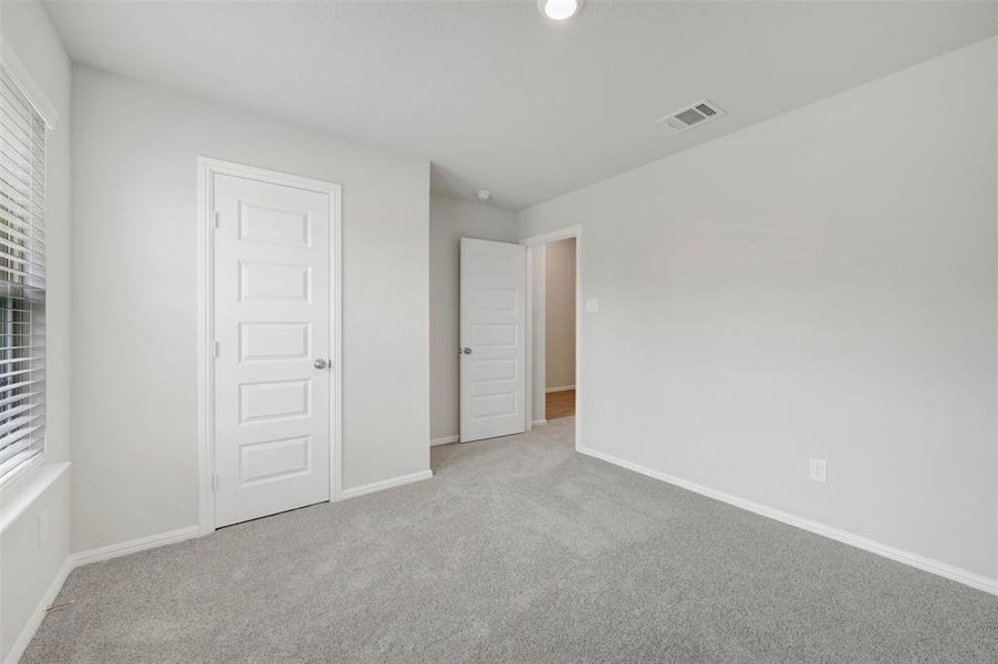 Spacious, unfurnished interior of a new home in Woodstone, Providence Village (Image 28).