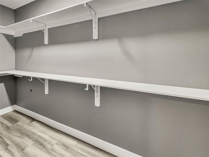 Walk-in closet with ample amount of storage space