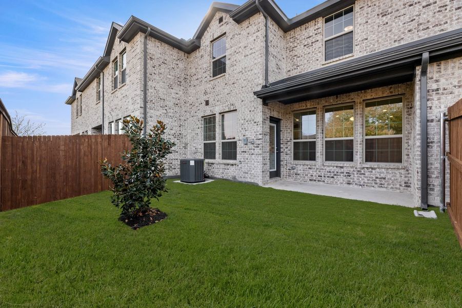 Front exterior of a new home in Main Street Village, Mansfield, TX, highlighting curb appeal (Image 26). Front exterior of a new home in Main Street Village, Mansfield, TX, highlighting curb appeal (Image 26).