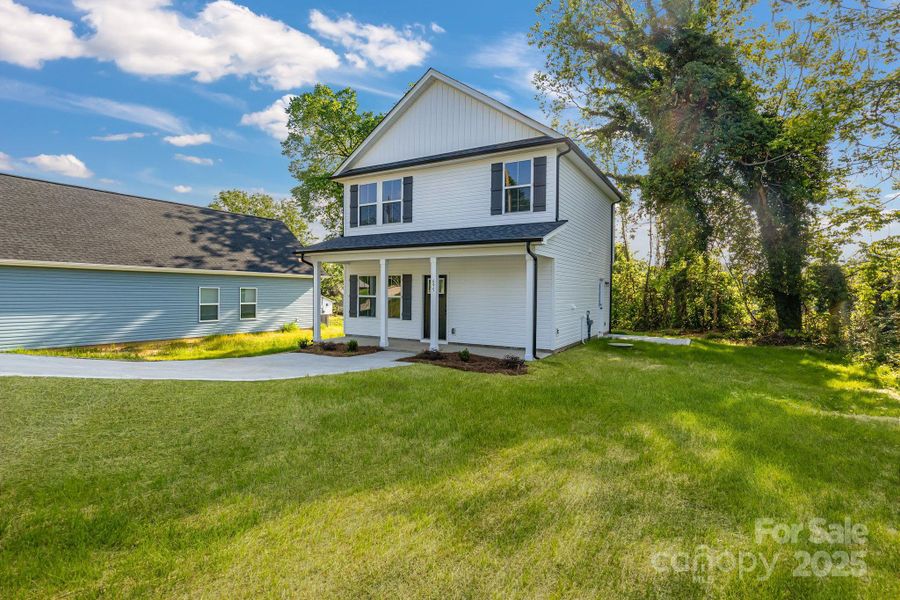 Front exterior of a new home in , Statesville, NC, highlighting curb appeal (Image 2).