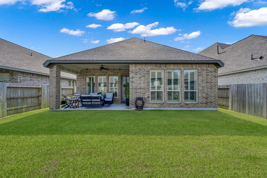 Front exterior of a new home in Grand Central Park 45', Conroe, TX, highlighting curb appeal (Image 22).