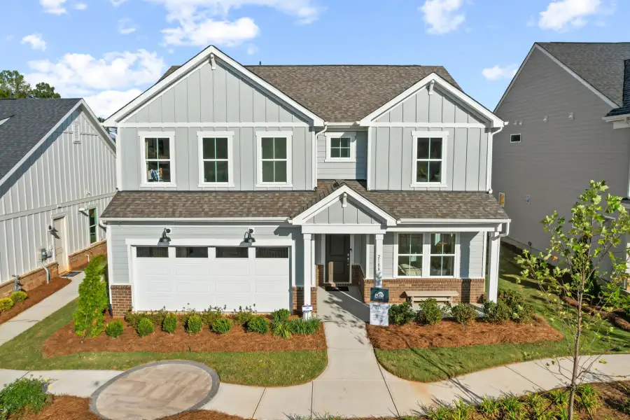 Front exterior of a new home in The Retreat at Carolina Ridge, Harrisburg, NC, highlighting curb appeal (Image 1). Front exterior of a new home in The Retreat at Carolina Ridge, Harrisburg, NC, highlighting curb appeal (Image 1).
