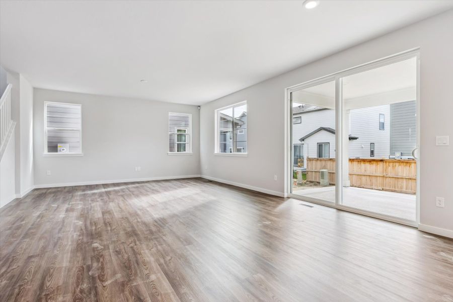 A room with a wood floor and a wood floor.