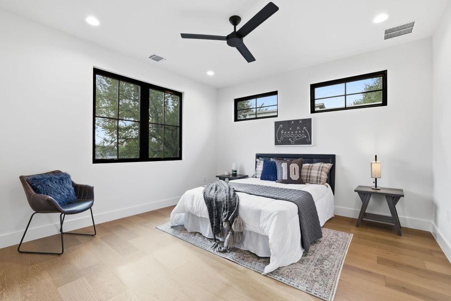 Bedroom featuring ceiling fan, recessed lighting, and light wood finished floors