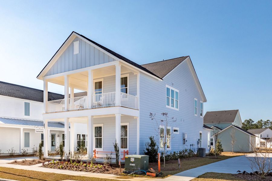 Front exterior of a new home in Sweetgrass at Summers Corner, Summerville, SC, highlighting curb appeal (Image 2). Front exterior of a new home in Sweetgrass at Summers Corner, Summerville, SC, highlighting curb appeal (Image 2).