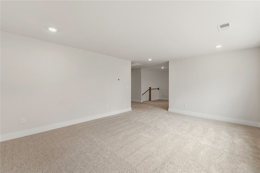 This versatile bonus room offers ample space, perf
