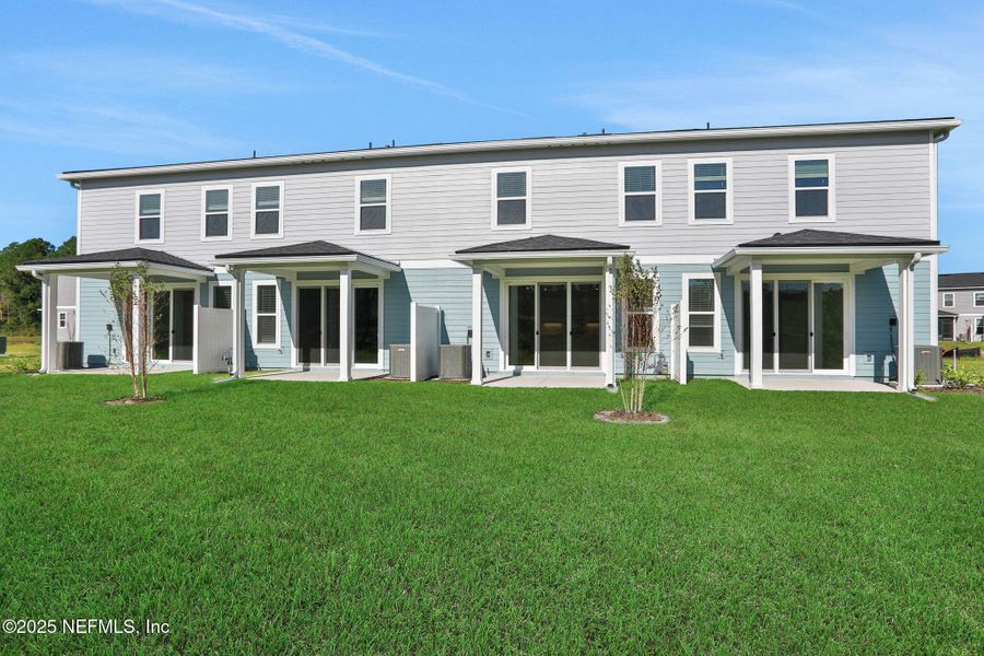 Exterior details and patio area of a home in Brook Forest - Townhomes, St. Augustine (Image 28).
