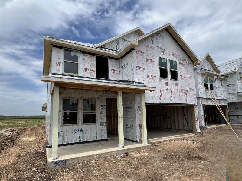 Front exterior of a new home in Rolling Glen, Hutto, TX, highlighting curb appeal (Image 2). Front exterior of a new home in Rolling Glen, Hutto, TX, highlighting curb appeal (Image 2).