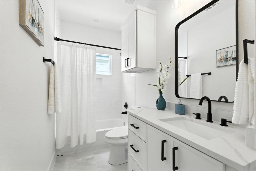Secondary bathroom upstairs also offers quartz countertops, black fixtures, tub/shower combo, soap niche, and bonus storage above the toilet! Secondary bathroom upstairs also offers quartz countertops, black fixtures, tub/shower combo, soap niche, and bonus storage above the toilet!