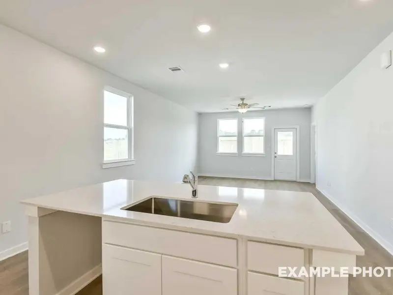 Furnished interior view inside a new home in Caney Creek Place, Conroe (Image 7).