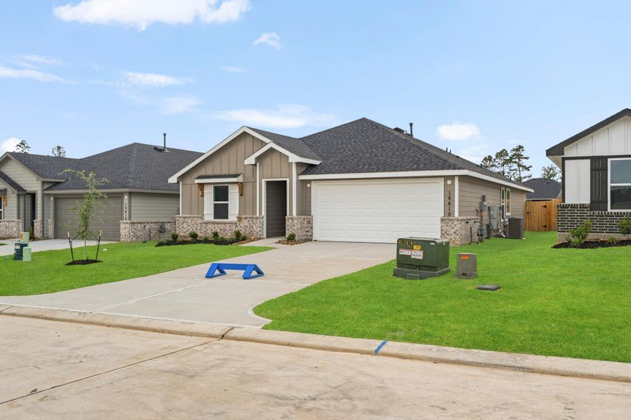 Front exterior of a new home in Chapel Lakes, Montgomery, TX, highlighting curb appeal (Image 18).