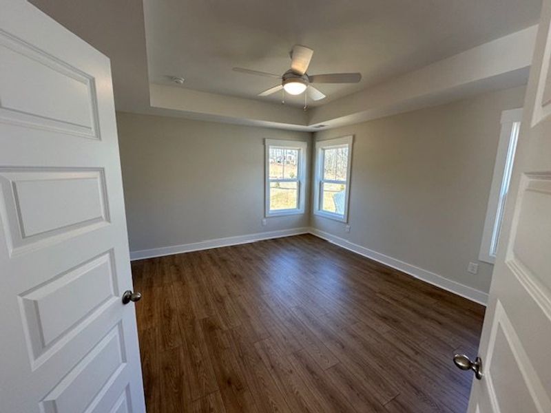 This spacious bedroom offers ample natural light a