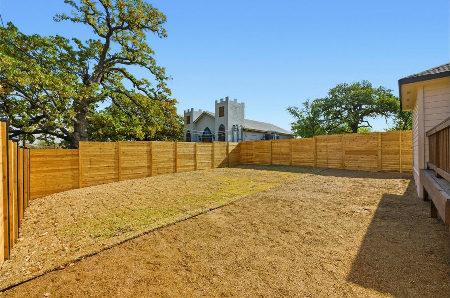 View of fenced backyard