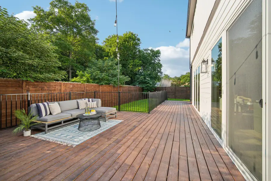 Deck featuring a fenced backyard and an outdoor living space