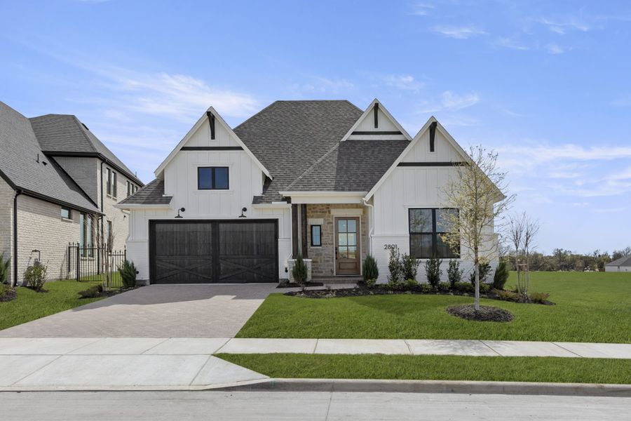 Front exterior of a new home in Mustang Lakes, Celina, TX, highlighting curb appeal (Image 1). Front exterior of a new home in Mustang Lakes, Celina, TX, highlighting curb appeal (Image 1).