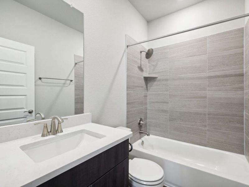 Furnished interior view inside a new home in Riverbend at Double Eagle - Boulevard Collection, Cedar Creek (Image 6).