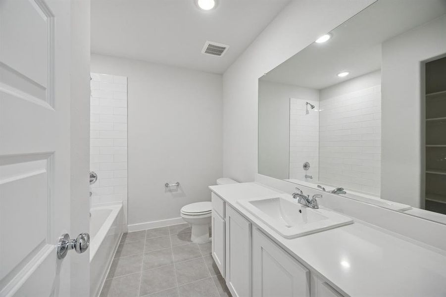 Bathroom in the Oak II home plan by Trophy Signature Homes – REPRESENTATIVE PHOTO