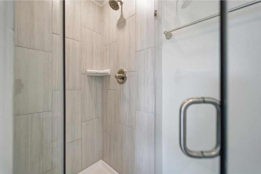 Full bathroom with a shower stall