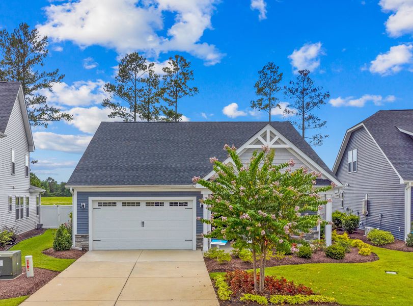 Representative exterior photo of a completed home built from the The Cherry Grove by Chesapeake Homes in The Willows, Loris, SC (Image 23).