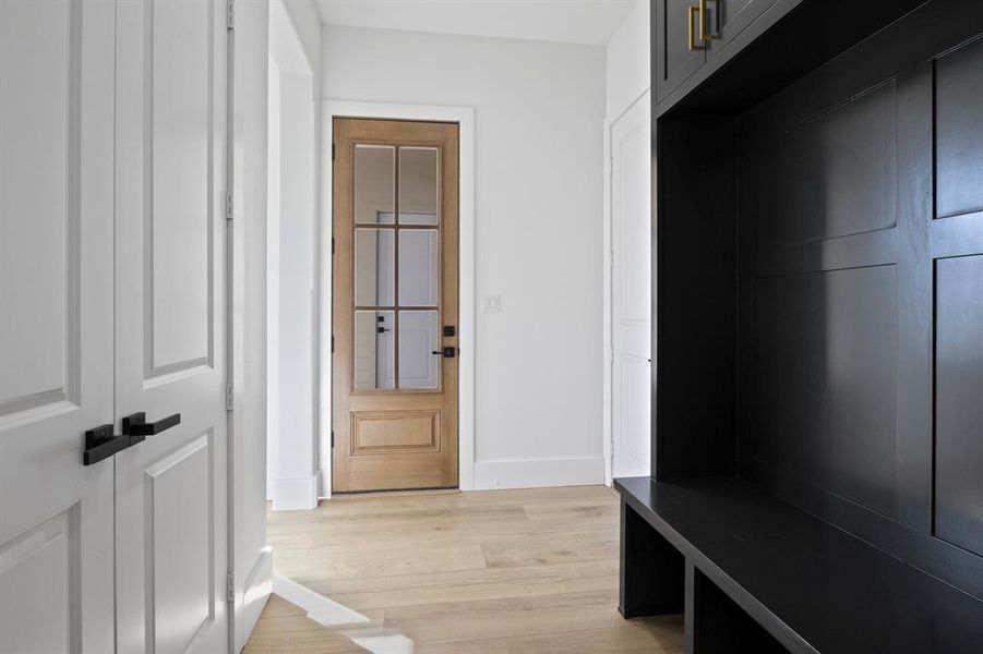 Mudroom featuring light wood finished floors and baseboards Mudroom featuring light wood finished floors and baseboards
