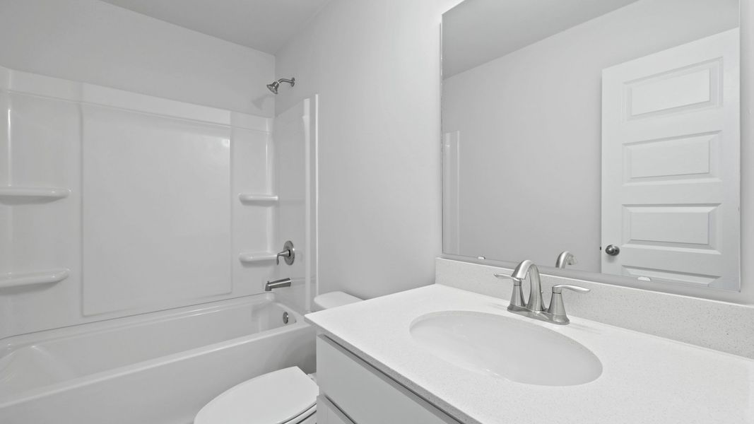 Representative furnished interior of a home built from the HARRIS by D.R. Horton in Sheep Island, Summerville (Image 11).