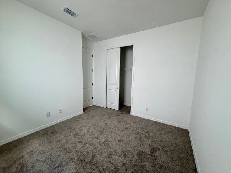 Representative unfurnished interior of a home built from the Juno by William Ryan Homes in The Sanctuary – Resort Collection, Punta Gorda (Image 28).