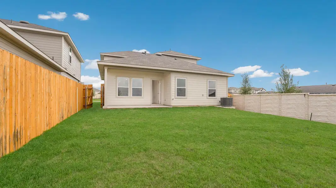 Exterior details and patio area of a home in Prairie Lakes, Buda (Image 3).