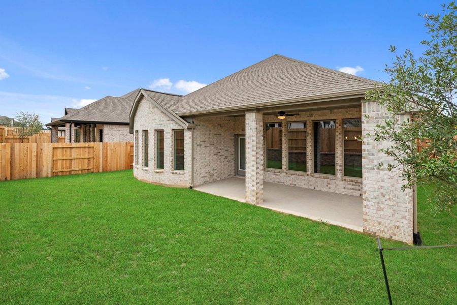 Exterior details and patio area of a home in Wildtree, Magnolia (Image 4).