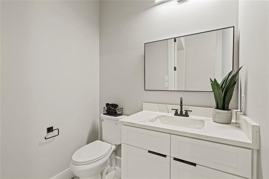 Bathroom featuring toilet and vanity