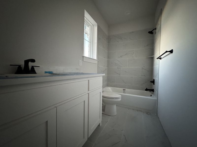 In-progress construction of a new home in Coyote Crossing, Godley, TX (Image 12).