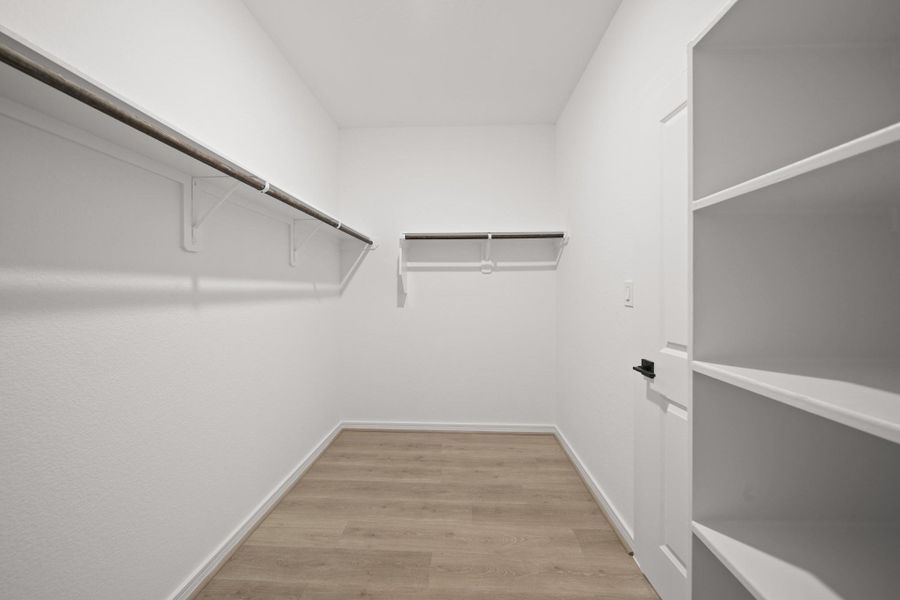 Primary walk-in closet (*Photo not of actual home and used for illustration purposes only.)