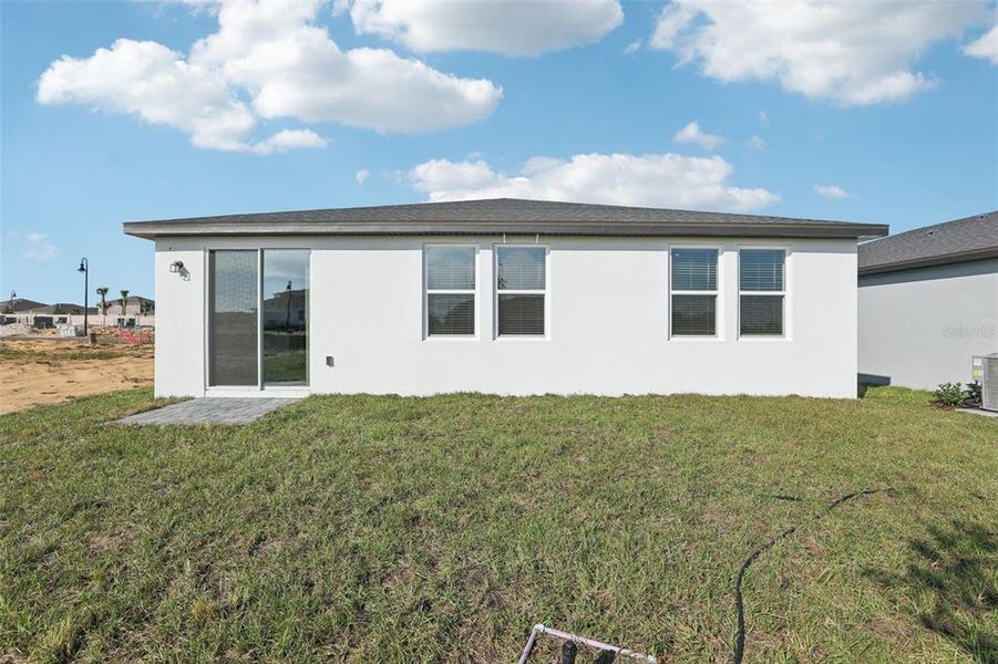 Exterior details and patio area of a home in Crosswinds - Signature Series, Haines City (Image 24).