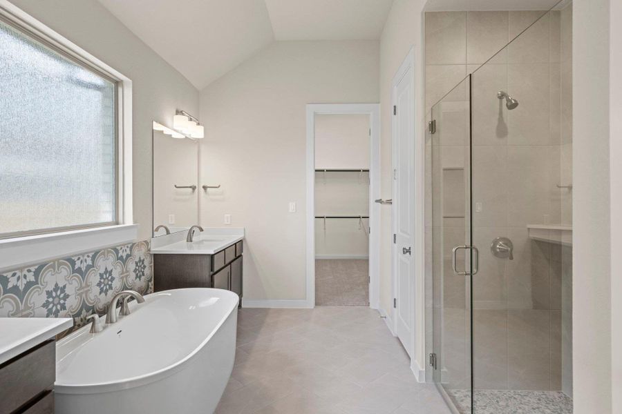 Primary Bath retreat with dual vanities, soaking tub & walk-in shower