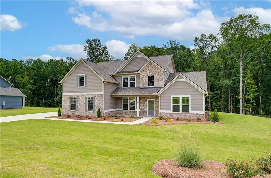 Front exterior of a new home in , Senoia, GA, highlighting curb appeal (Image 18). Front exterior of a new home in , Senoia, GA, highlighting curb appeal (Image 18).