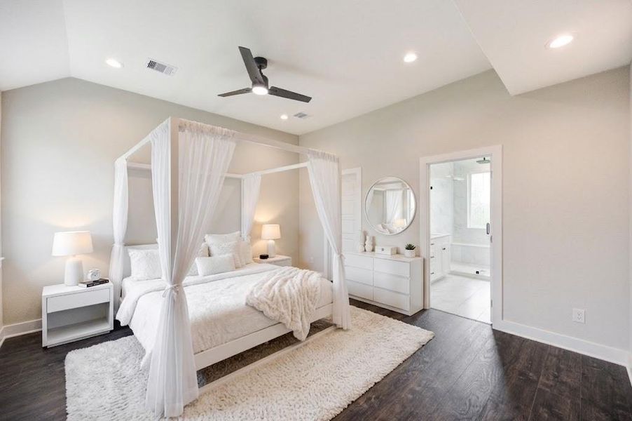 Larger appointed primary suite with vaulted ceilings, and abundant natural lighting. The perfect retreat from the urban city life.