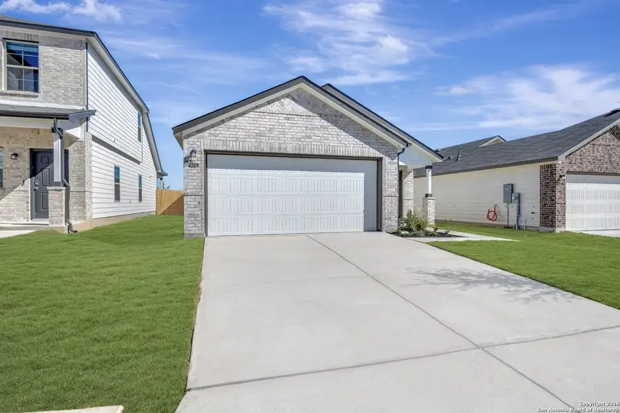 Front exterior of a new home in Park Place, New Braunfels, TX, highlighting curb appeal (Image 2). Front exterior of a new home in Park Place, New Braunfels, TX, highlighting curb appeal (Image 2).
