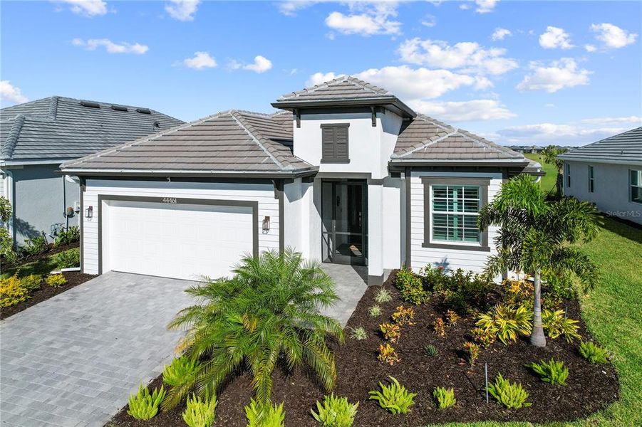 Front exterior of a new home in , Punta Gorda, FL, highlighting curb appeal (Image 21).