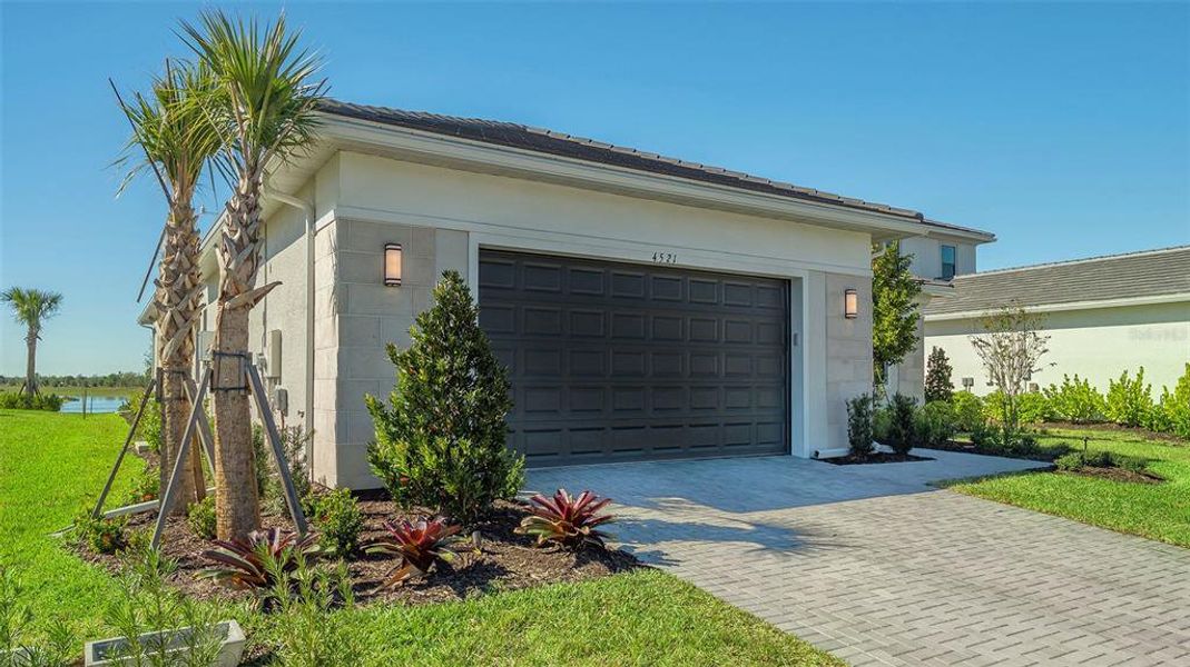 Front exterior of a new home in , Sarasota, FL, highlighting curb appeal (Image 31).