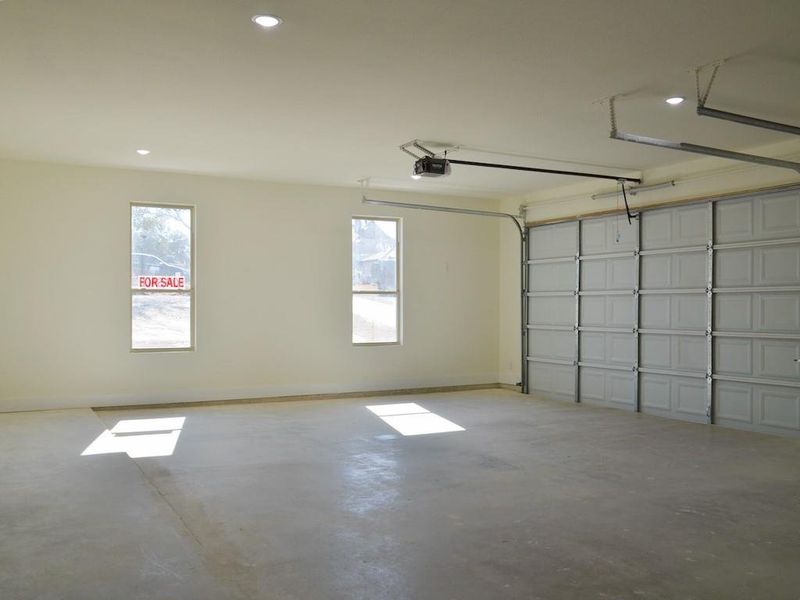 Garage featuring a garage door opener