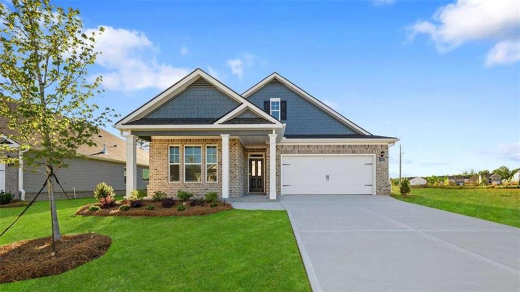 Front exterior of a new home in Oak Ridge Meadows - Active Adult, Locust Grove, GA, highlighting curb appeal (Image 1). Front exterior of a new home in Oak Ridge Meadows - Active Adult, Locust Grove, GA, highlighting curb appeal (Image 1).