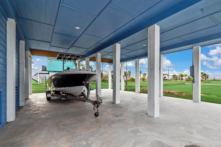 Fully covered concrete area on 1st floor great for parking boats, jet-skis and all other vehicles.