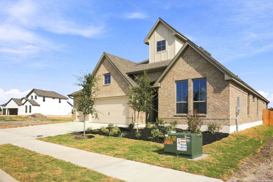 Front exterior of a new home in Legacy at Lake Dunlap, New Braunfels, TX, highlighting curb appeal (Image 23). Front exterior of a new home in Legacy at Lake Dunlap, New Braunfels, TX, highlighting curb appeal (Image 23).