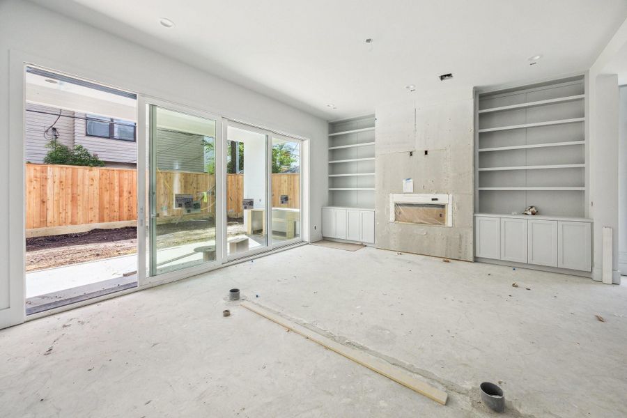 Family Room with a Multi-Slide Panel Door that opens to the Covered Lanai bringing the outdoor space inside.Construction as of September 29th, 2025.